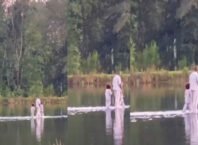 Kanye West walks on water with his kids